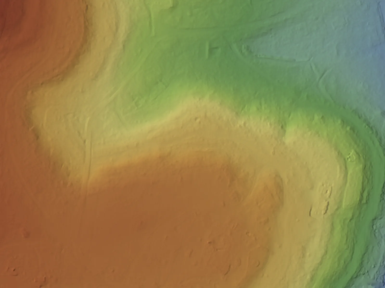 The bare ground coloured by height, blue in the low draws to red on the high ground, shaded so the shape reads